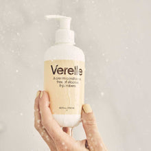 Load image into Gallery viewer, hand holding verelle cream conditioner in shower